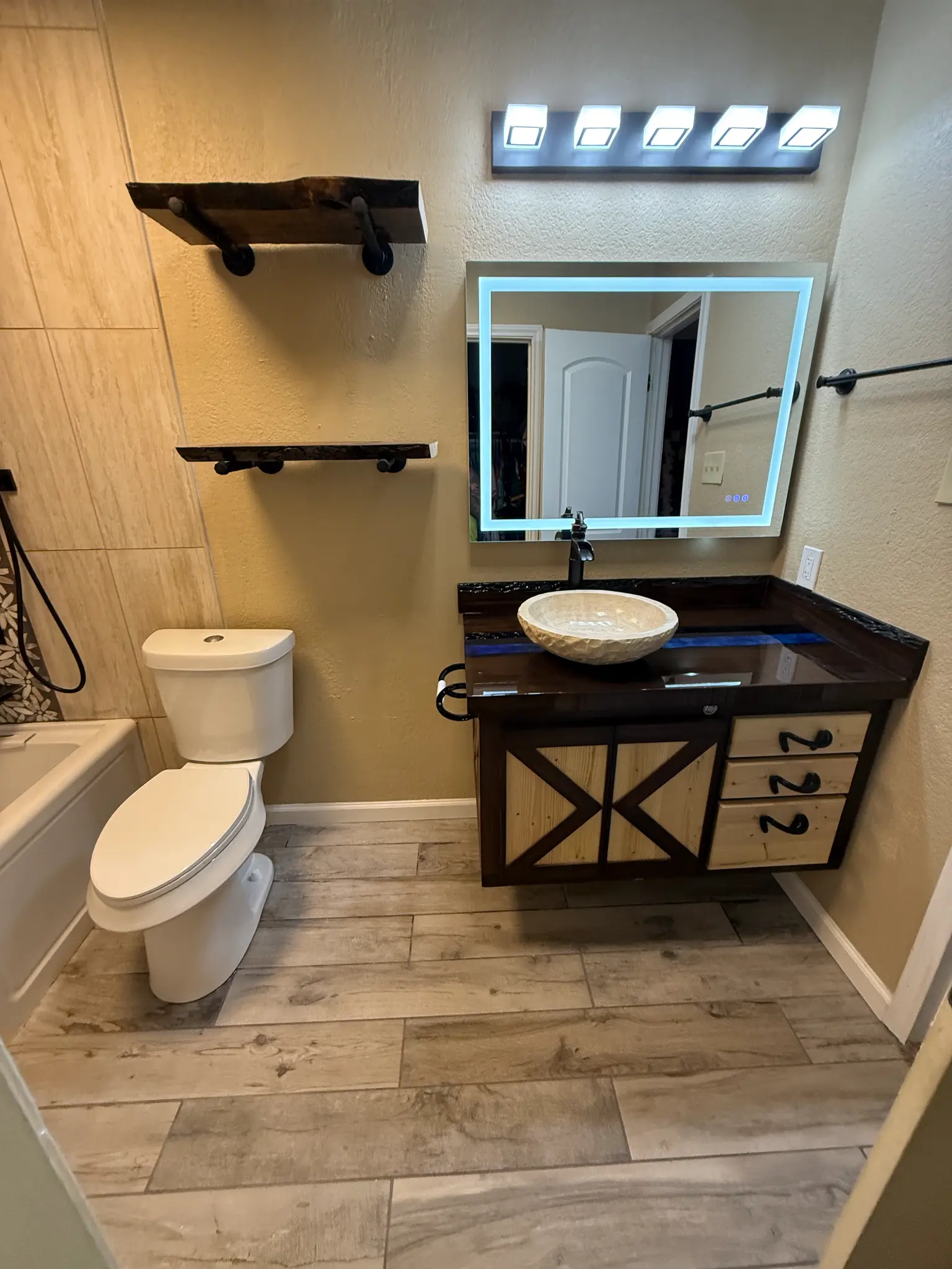 Rustic bathroom vanity with LED mirror